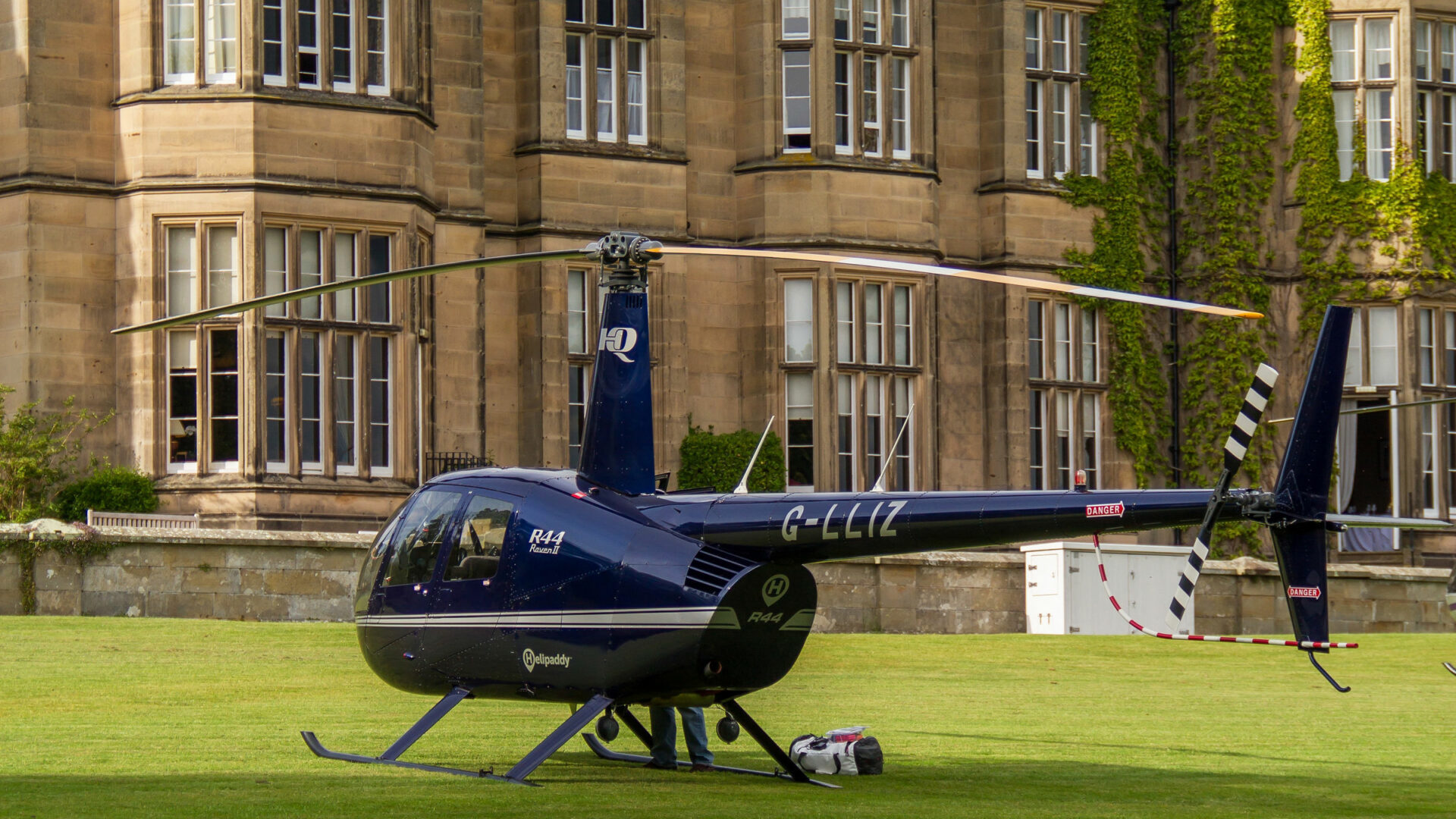 Helicopter parked on a grass lawn