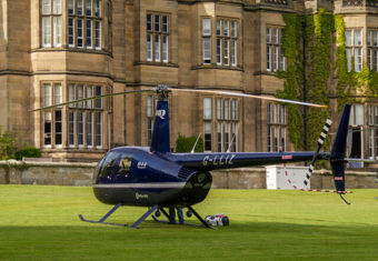 Helicopter parked on a grass lawn