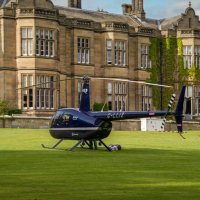 Helicopter parked on a grass lawn